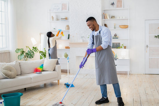 man and woman tidying home
