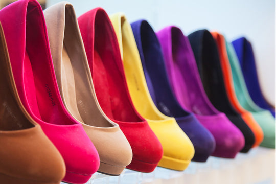 pairs of women shoes in rack